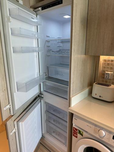 a refrigerator with its door open in a kitchen at 7 Palm Jumeirah in Dubai