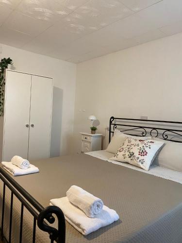 a bedroom with a bed with towels on it at Civico 38 Pescara in Pescara