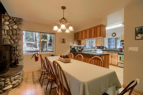 a kitchen and dining room with a table and chairs at Hibernation Hideaway- Inside Yosemite- Dog Friendly in South Wawona