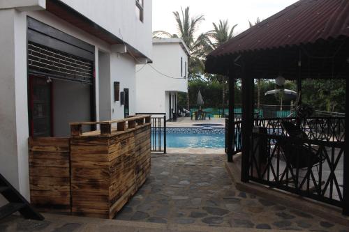 a house with a fence and a swimming pool at NARU Extremo in Utica