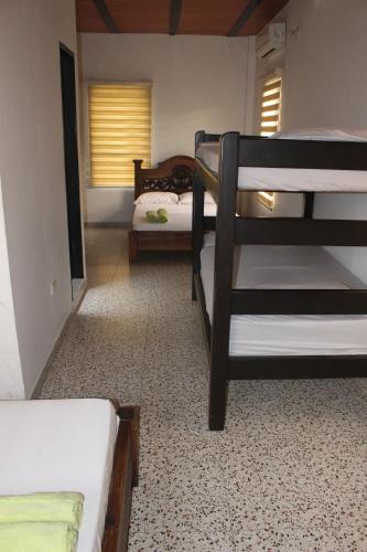 a room with two bunk beds in a room at NARU Extremo in Utica