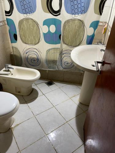 a bathroom with a toilet and a sink at برج المحطة in Sharjah