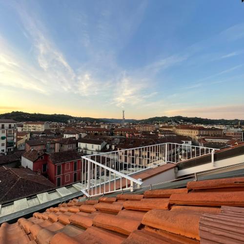 a view of a city from the roof of a building at La casetta sui tetti in Alba