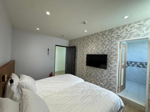Postel nebo postele na pokoji v ubytování Yongshanshui B&B