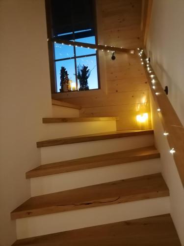 a set of stairs in a house with lights at Lärchenhaus ,,Unterer Brodl" in Kammersberg