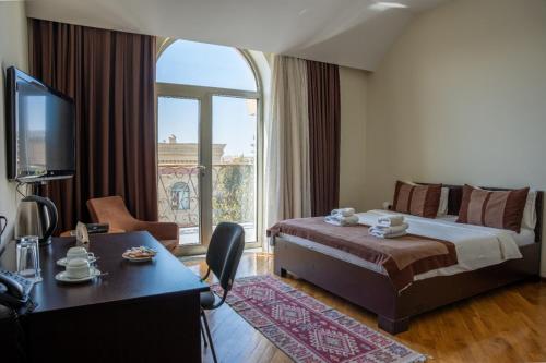 Ένα ή περισσότερα κρεβάτια σε δωμάτιο στο Green City Resort Hotel