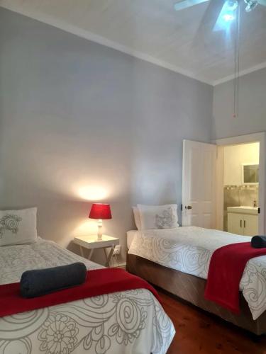 Ένα ή περισσότερα κρεβάτια σε δωμάτιο στο Point Village Accommodation - Uppercross 3