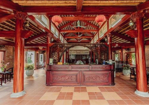 a large room with a bar in a building at Hoa Lu Garden Resort in Ninh Binh