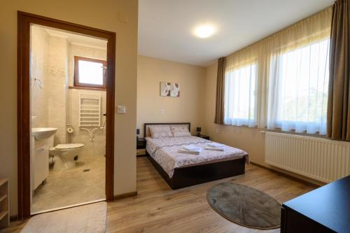 Postel nebo postele na pokoji v ubytování Rila Hills