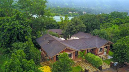 an overhead view of a house with a roof at Bougain Villa Resort Park By Dream Villas in Pune