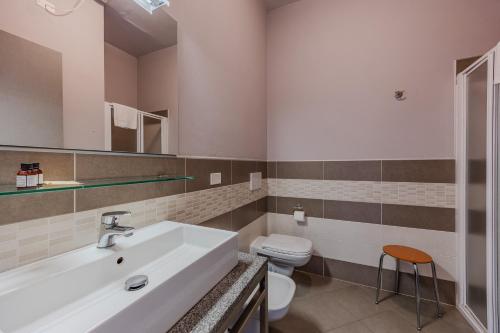 a bathroom with a sink and a toilet at Residence San Michele in Costermano sul Garda