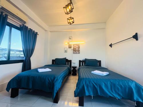 Postel nebo postele na pokoji v ubytování Vang Vieng Santara Hostel