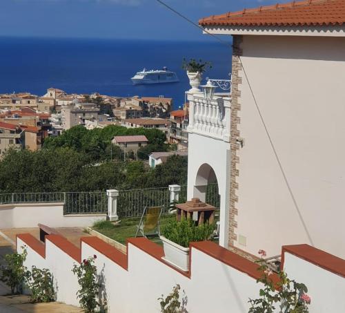 a balcony with a view of a cruise ship at Appartamenti Borgo Panoramico N 5 in Tropea