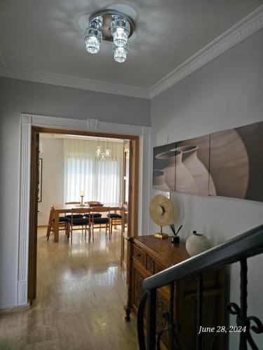 a living room with a table and a dining room at Villa Kyrenia in Lapithos