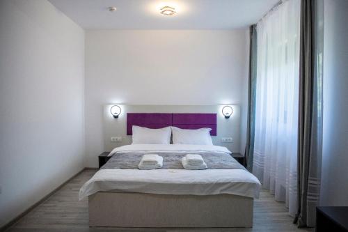 Postel nebo postele na pokoji v ubytování Casa Orhideea