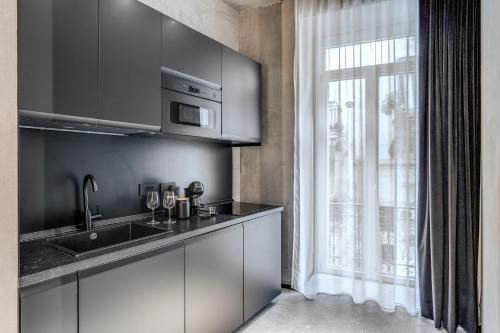 Η κουζίνα ή μικρή κουζίνα στο Gallery Home
