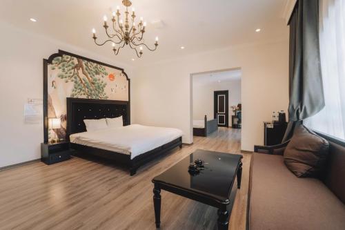 Ένα ή περισσότερα κρεβάτια σε δωμάτιο στο Tam Coc Sana Villa & Homestays
