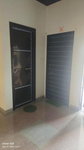 a large black garage door in a room at Radha Krishan Guesthouse,Khatu shyam ji,Sikar in Khātu