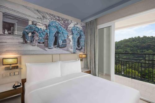 Voodi või voodid majutusasutuse Radisson Hotel Kandy toas