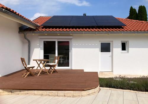 a solar panel on the roof of a house at Appartement mit Pool in Kirchen