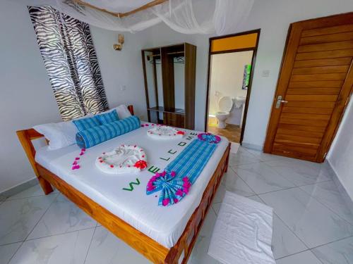 Postel nebo postele na pokoji v ubytování Silent Palms Villa
