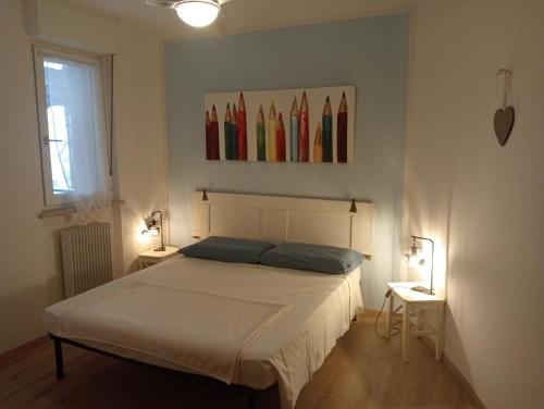 A bed or beds in a room at B&B Color Rovereto