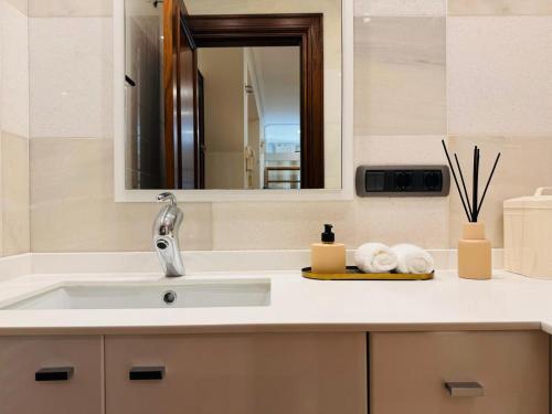 a bathroom with a sink and a mirror at Green Salt in Vigo