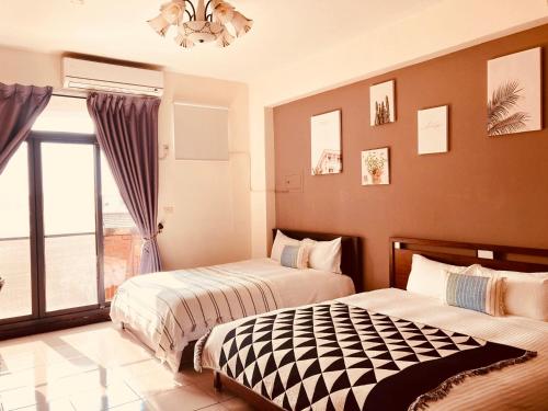 Postel nebo postele na pokoji v ubytování Grace Homestay