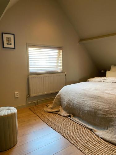 Postel nebo postele na pokoji v ubytování Guesthouse Porter Noordwijk