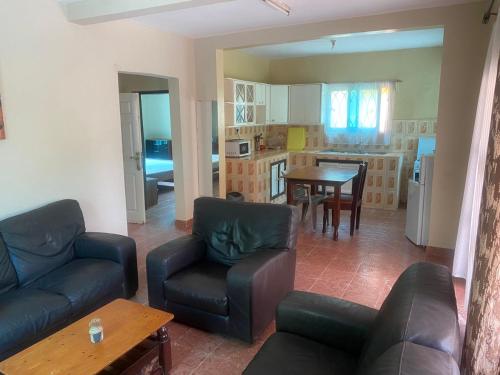 a living room with a couch and a table at Harmony house apartments in Ker Bakary
