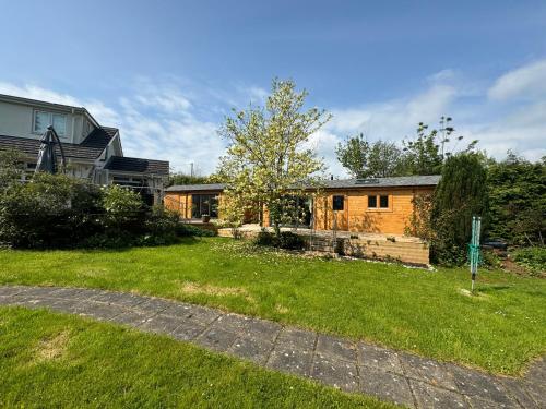 a home with a yard with a house at Log Cabin in Monmouth