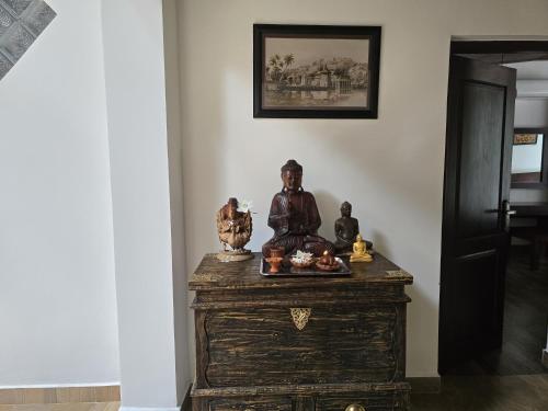 a statue sitting on top of a dresser in a room at Villa D55 in Kandy