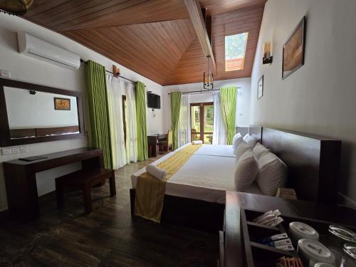 a bedroom with a bed and a desk in a room at Villa D55 in Kandy
