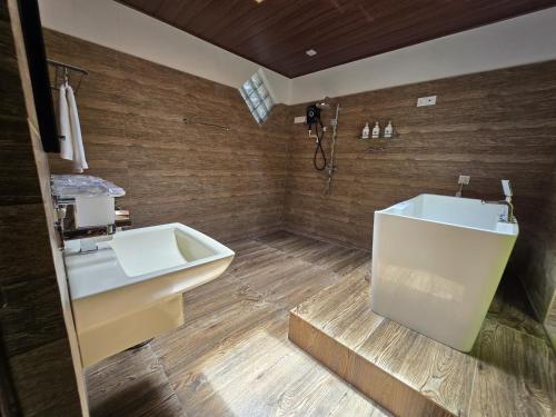 a bathroom with a sink and a bath tub at Villa D55 in Kandy