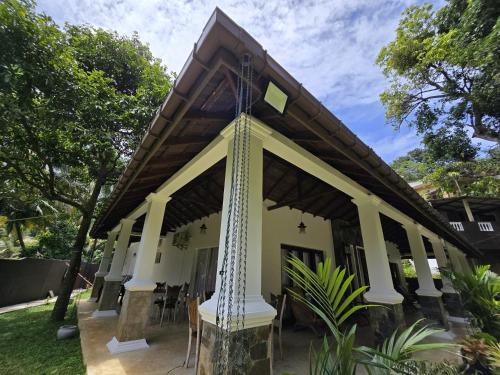a building with a flag pole in front of it at Villa D55 in Kandy