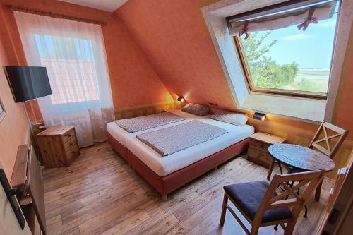Katil atau katil-katil dalam bilik di Ferienhaus Appelgarten
