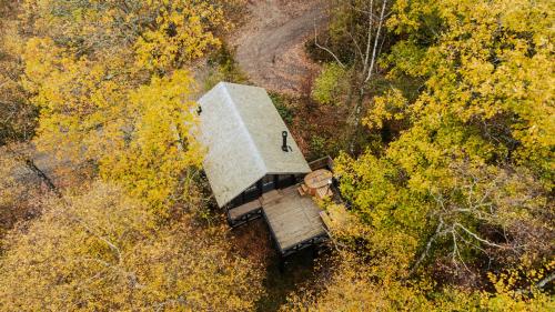 an aerial view of a small building in the woods at Les cabanes des Dolimarts in Bohan