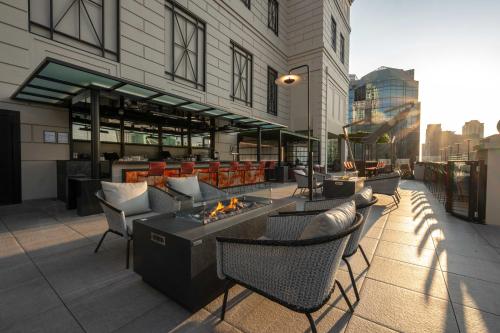 a patio with chairs and a fire pit on a building at Riu Plaza Chicago in Chicago