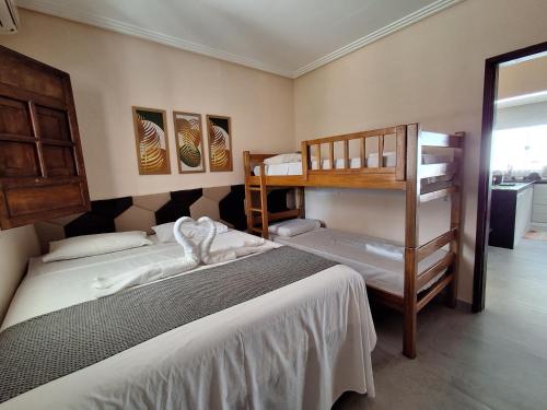 Letto o letti in una camera di Casa com PISCINA na praia de peroba MARAGOGI