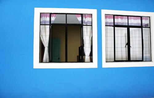 a reflection of a person in a mirror at Andaina Youth Hostel in Oaxaca City
