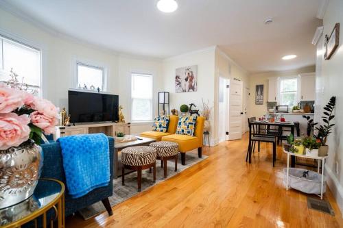 a living room with a couch and a table at 14b-Newly Renovated, Uniquely decorated Apartment in Boston