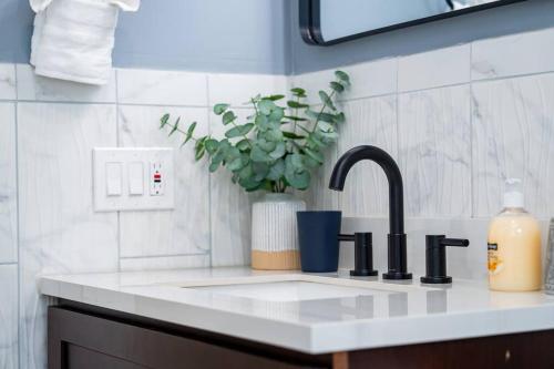 a kitchen counter with a sink with a faucet at 14b-Newly Renovated, Uniquely decorated Apartment in Boston