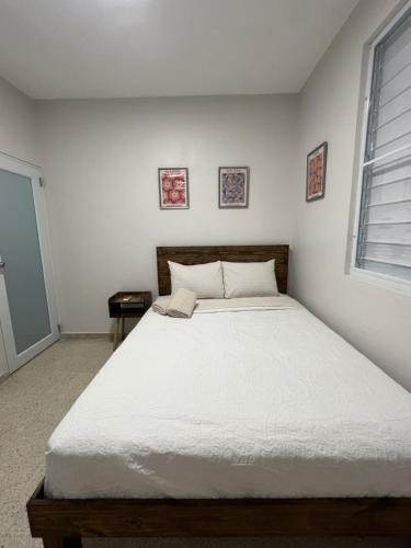 Ένα ή περισσότερα κρεβάτια σε δωμάτιο στο 3-Bedroom House in Quebradillas