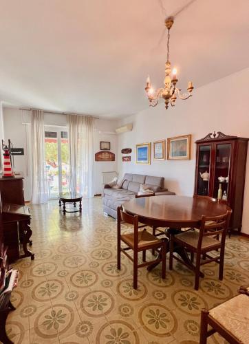 a living room with a table and a couch at Betti 21 in Rapallo