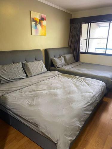 Кровать или кровати в номере Brinchang Cameron 2R2B 10 paxs Copthorne KeaFarm #15407