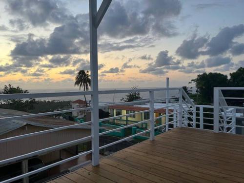 a balcony of a house with a view of the ocean at Ocean View Rooftop, Casa Estela Mar, Isabela, Cozy, Boutique in Isabela