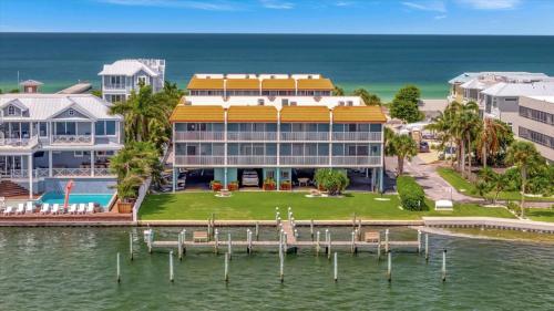 an aerial view of a large house on the water at Cheerful Pelican on Anna Maria Island in Bradenton Beach