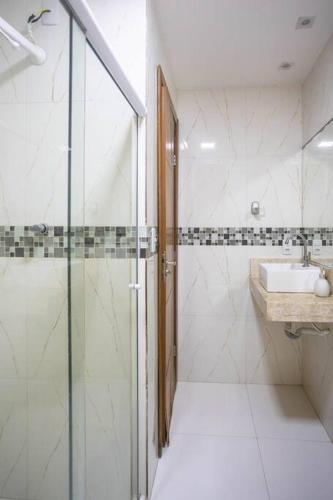 a bathroom with a shower and a sink at Recanto de Stella Maris in Salvador