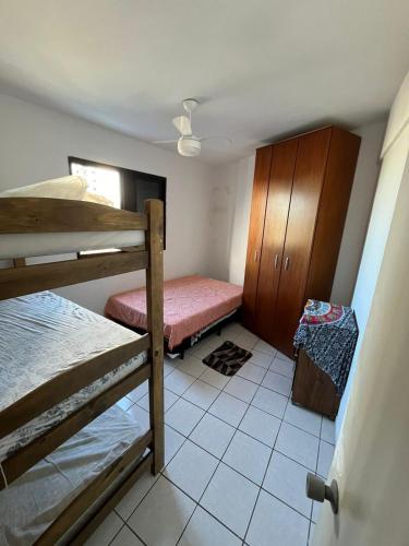 Katil atau katil-katil dalam bilik di Apartamento Praia Ocian