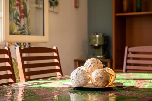 a plate with two coconuts on a table at Villa Dora in Trabia